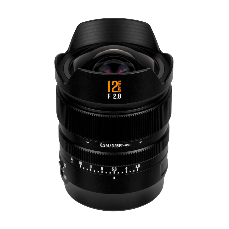 Wide-angle camera lens with 12mm F2.8 label, black with focus and aperture rings visible.