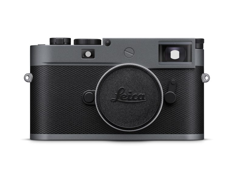 Front view of a black Leica camera with a lens cap, textured grip, and silver accents.