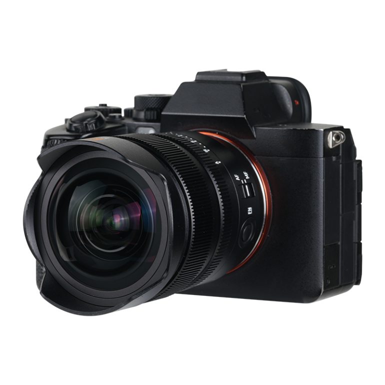 Black digital camera with a large lens facing forward, isolated on a white background.