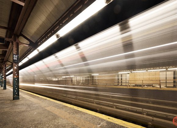 These are Some of the Best Presets You'll Own A subway train speeds through a dimly lit station with a 52 St sign and empty platform.