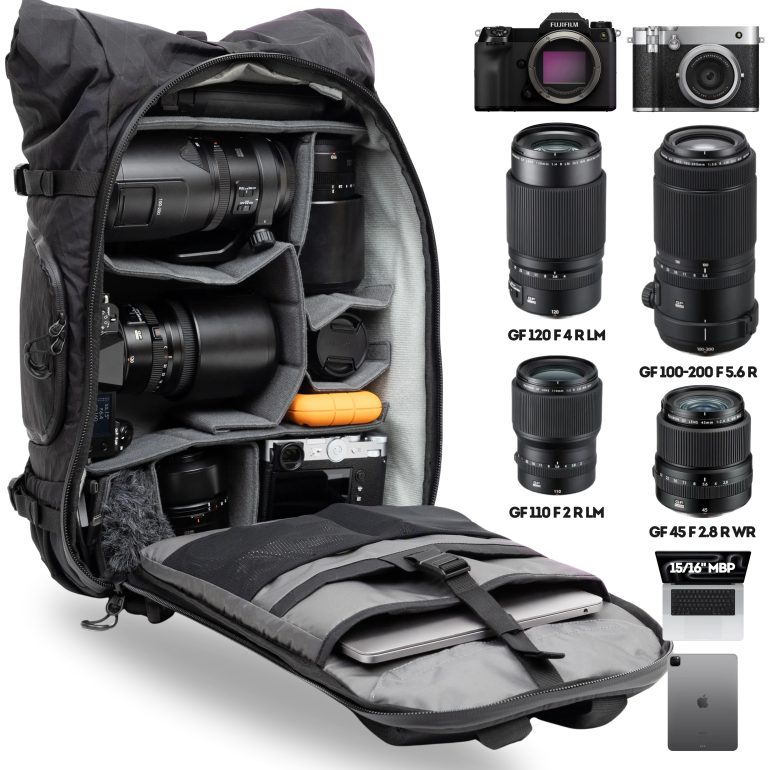 Open camera backpack with lenses, cameras, accessories, and MacBook Pro; gear displayed on the right.
