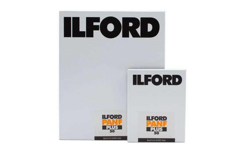 Two boxes of Ilford Pan F Plus 50 black and white film, one large and one small, on a white background.