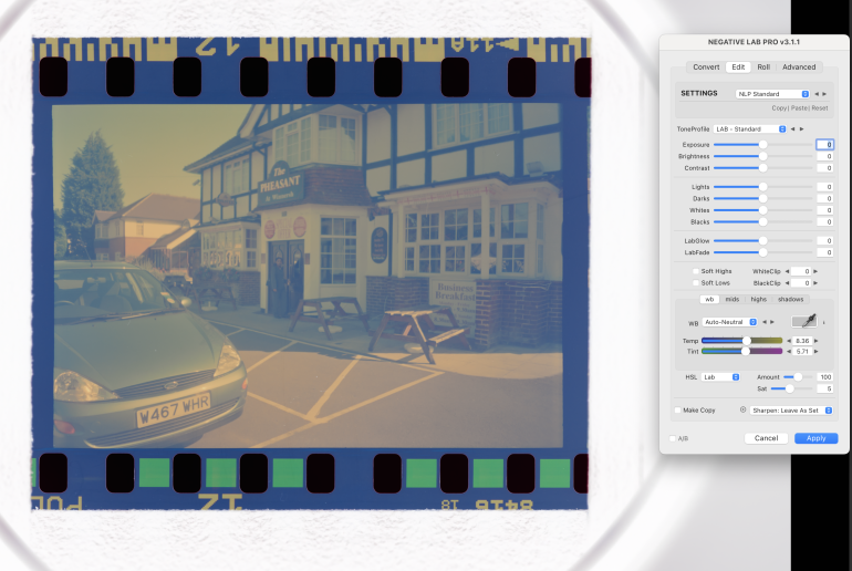 A scanned film negative of a pub and cars, with editing software settings panel visible on the right.