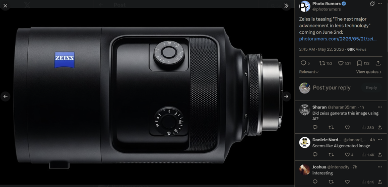 Close-up of a black Zeiss camera lens with dials and a blue Zeiss logo against a black background.