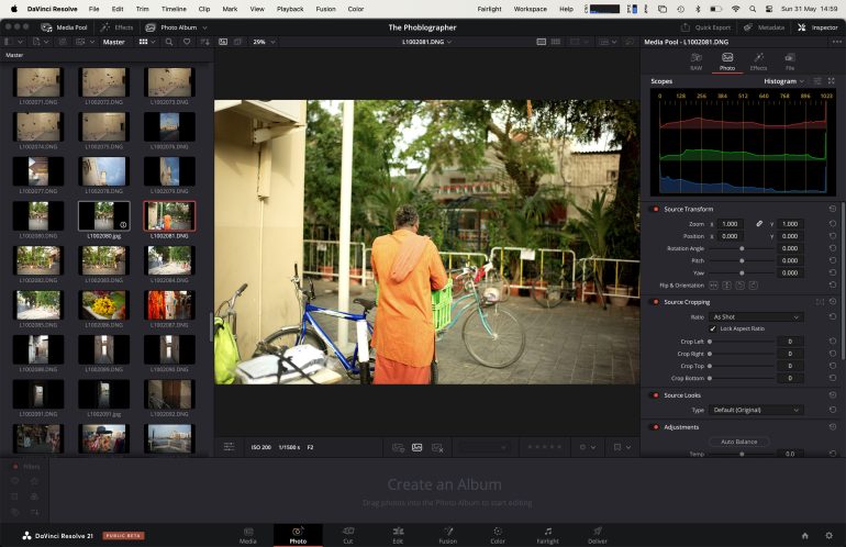 A person in orange stands by a bicycle outdoors, seen on a video editing software screen.