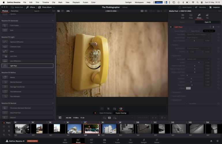 A yellow rotary phone mounted on a textured wall, shown in a video editing software interface.