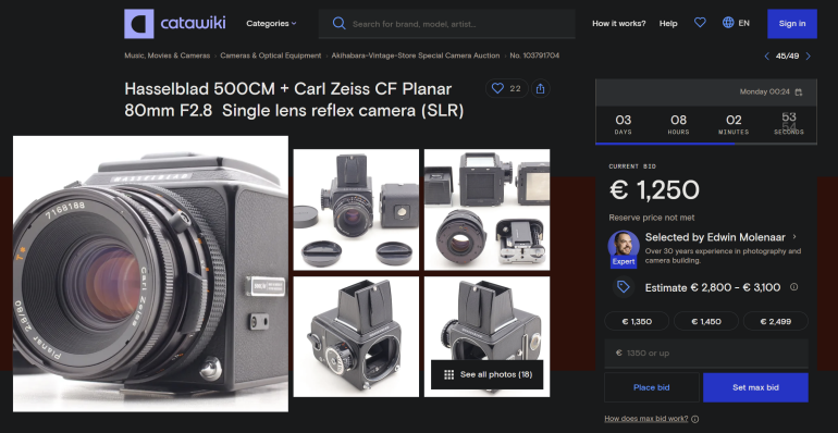 Close-up and multiple angles of a Hasselblad 500CM camera with Carl Zeiss lens on an online auction page.