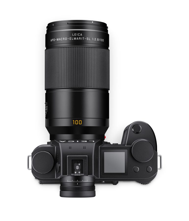 Top view of a black Leica camera with an attached APO-Macro-Elmarit-SL 100mm lens.