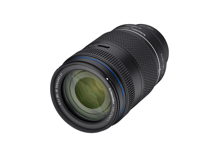 A black camera lens with blue and white markings, displayed on a white background.