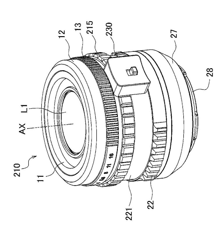 Technical line drawing of a camera lens with labeled parts and detailed mechanical features.