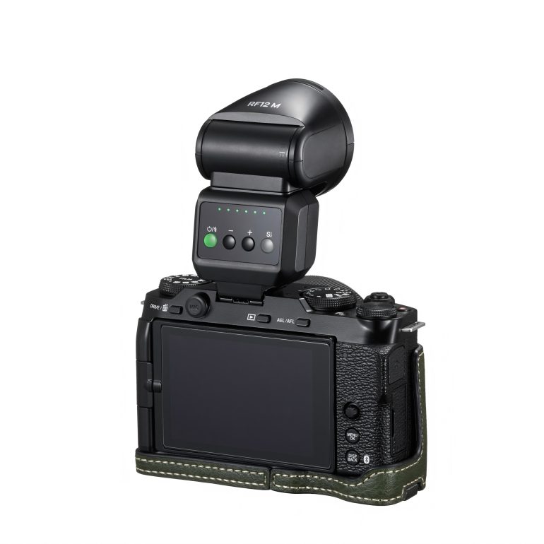 A digital camera with a flash unit attached, shown from the back against a white background.