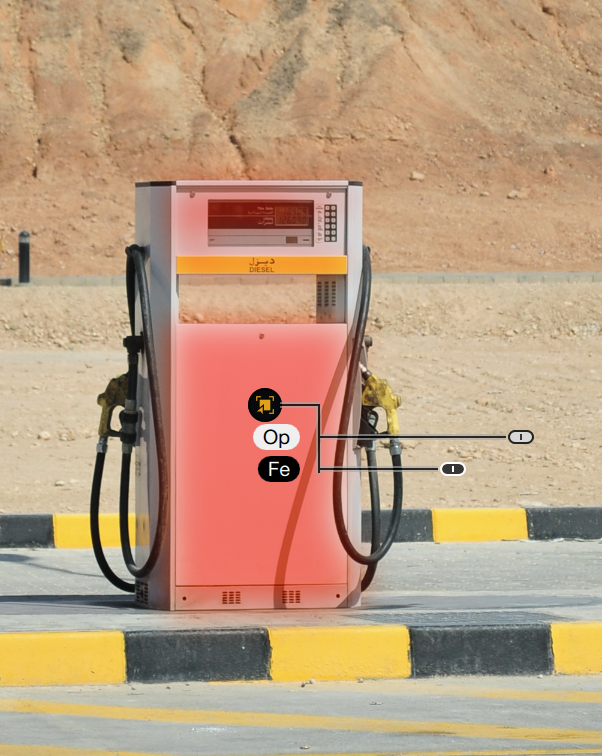 A gas pump with digital interface and labeled buttons reading Op and Fe in a desert setting.