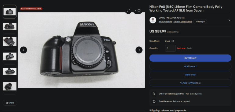 Black Nikon F60 (N60) 35mm film SLR camera body shown on a white background in an online listing.