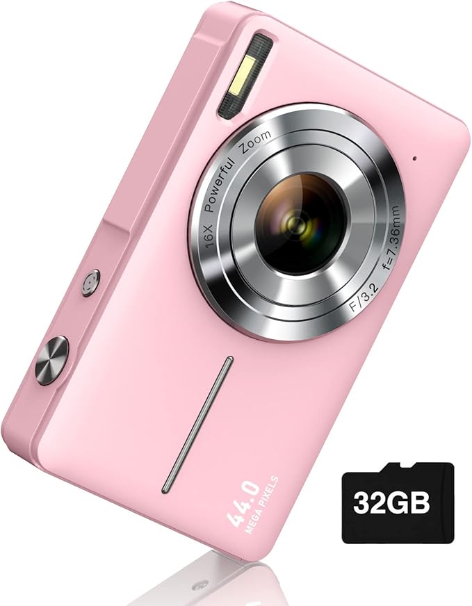 Pink digital camera with large lens and 44.0 MP label, next to a black 32GB memory card.