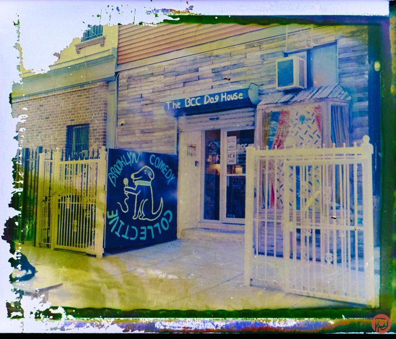 A building with a sign reading The BCC Dog House and a “Brooklyn Comedy Collective” sign outside.
