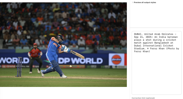 India batsman in blue hits a cricket ball during a match, with crowd and Bangladesh player in background.