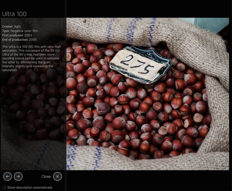 A burlap sack filled with hazelnuts and a small sign labeled 275 resting on top.