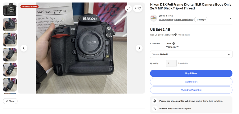 Hand holding a Nikon D3X camera body with no lens, shown on an online marketplace listing.