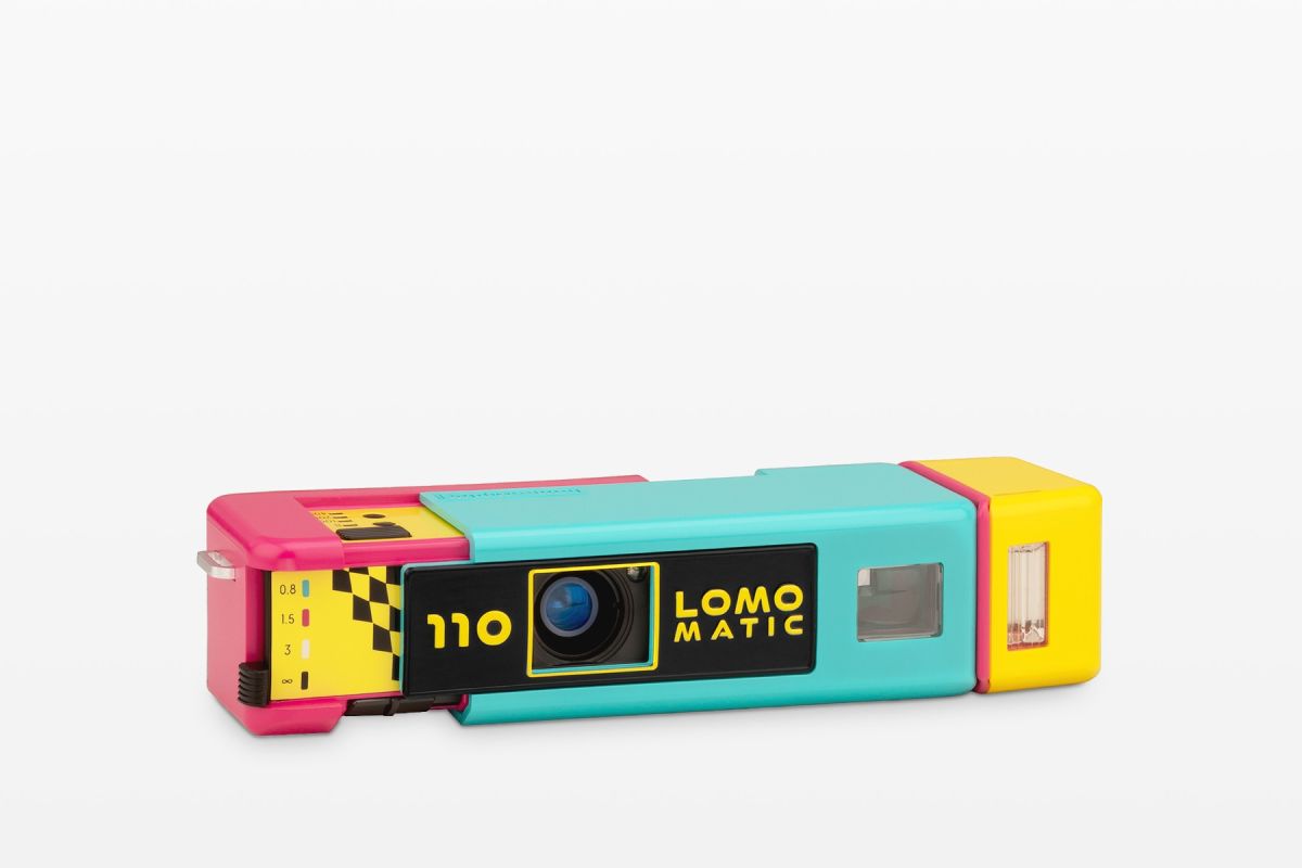 The Lomomatic 110 Discomatic is Bound to be Disappointing Colorful vintage LomoMatic 110 camera with yellow, pink, blue, and black accents on a white background.