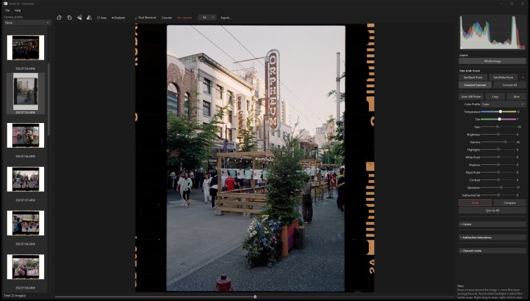 A photo editing program shows a lively street scene with an Orpheum sign and people walking outside.