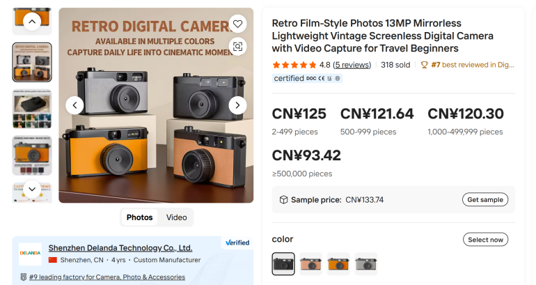 Three retro-style digital cameras in black, grey, and orange on a table, with text promoting their features.